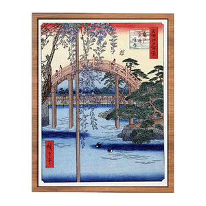 Footbridge over river with wisteria in foreground in full bloom