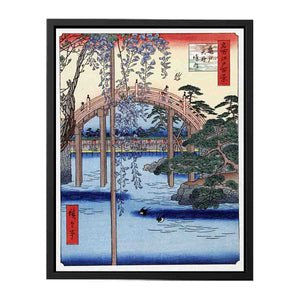 Footbridge over river with wisteria in foreground in full bloom