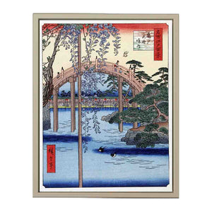 Footbridge over river with wisteria in foreground in full bloom