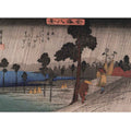 Two men on a sloping road in the rain