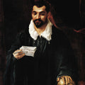 Portrait of a man holding a skull 