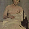 Sitting woman with bare breasts 