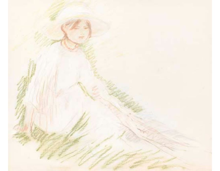 Fillette assise dans l'herbe