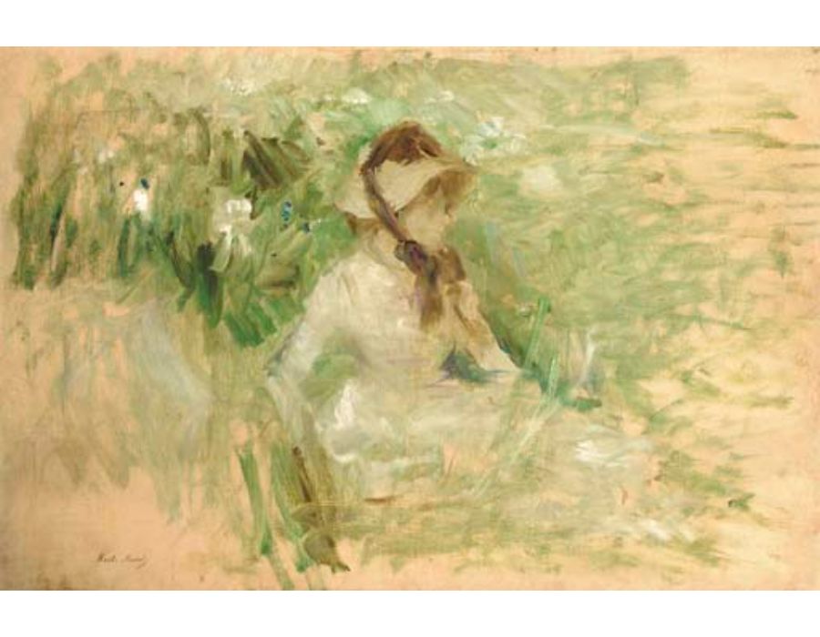 Jeune femme assise dans l'herbe