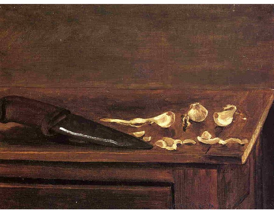 Garlic Cloves And Knife On The Corner Of A Table