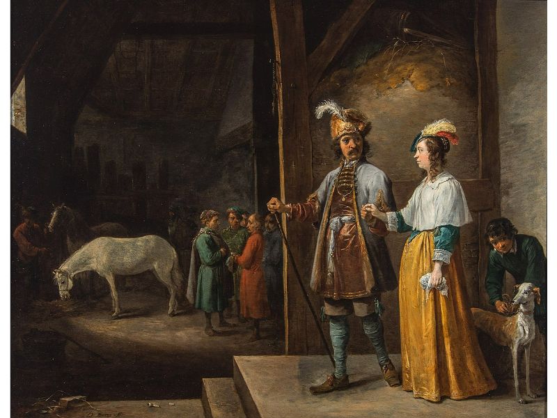 A lady and gentleman entering a stable 